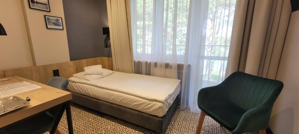 Posteľ alebo postele v izbe v ubytovaní Hotel Wojciech