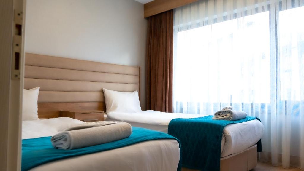 Postel nebo postele na pokoji v ubytování Bursa Suites Apart Otel