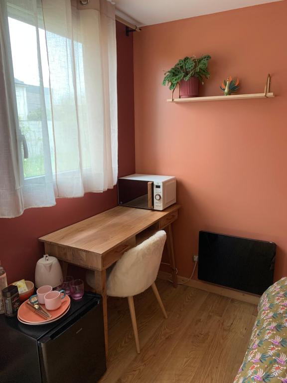Χώρος καθιστικού στο Chambre avec entrée privée