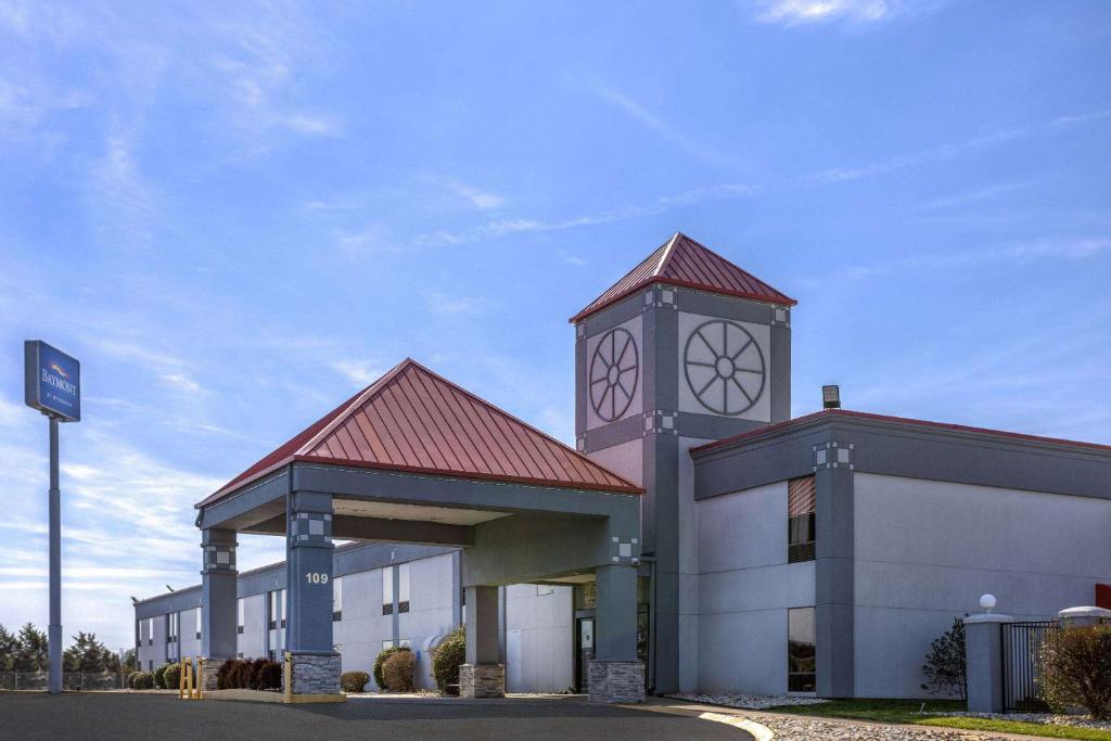 a building with a clock tower on top of it at Baymont by Wyndham LaVergne in La Vergne
