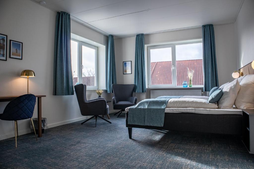 Postel nebo postele na pokoji v ubytování Hotel Phønix Hjørring