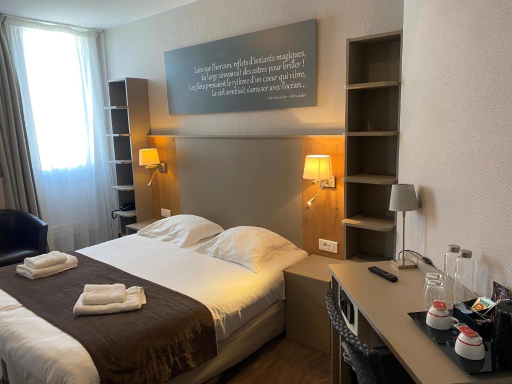 Postel nebo postele na pokoji v ubytování Hôtel Villa Des 2 Caps