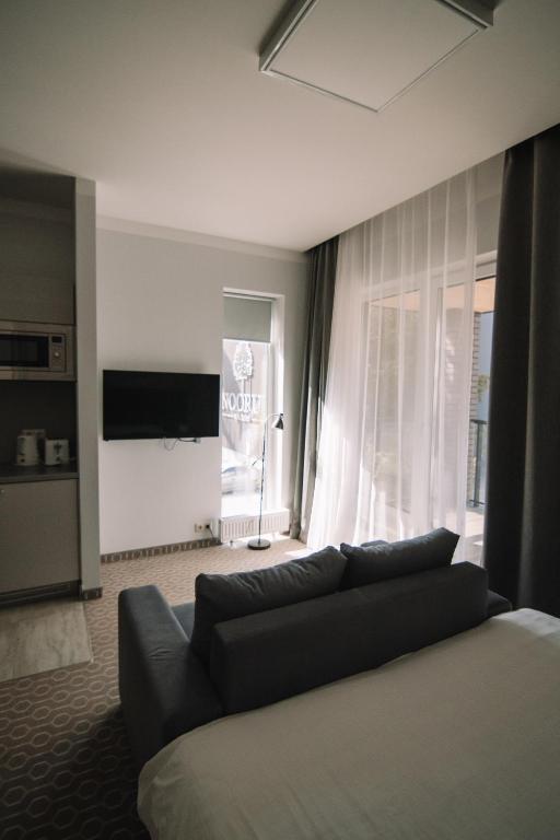 Postel nebo postele na pokoji v ubytování Merepargi ApartHotel & Cafe