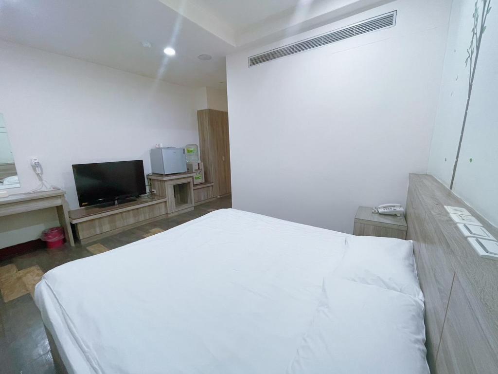 TV a/nebo společenská místnost v ubytování A22 Wei Lu Hotel