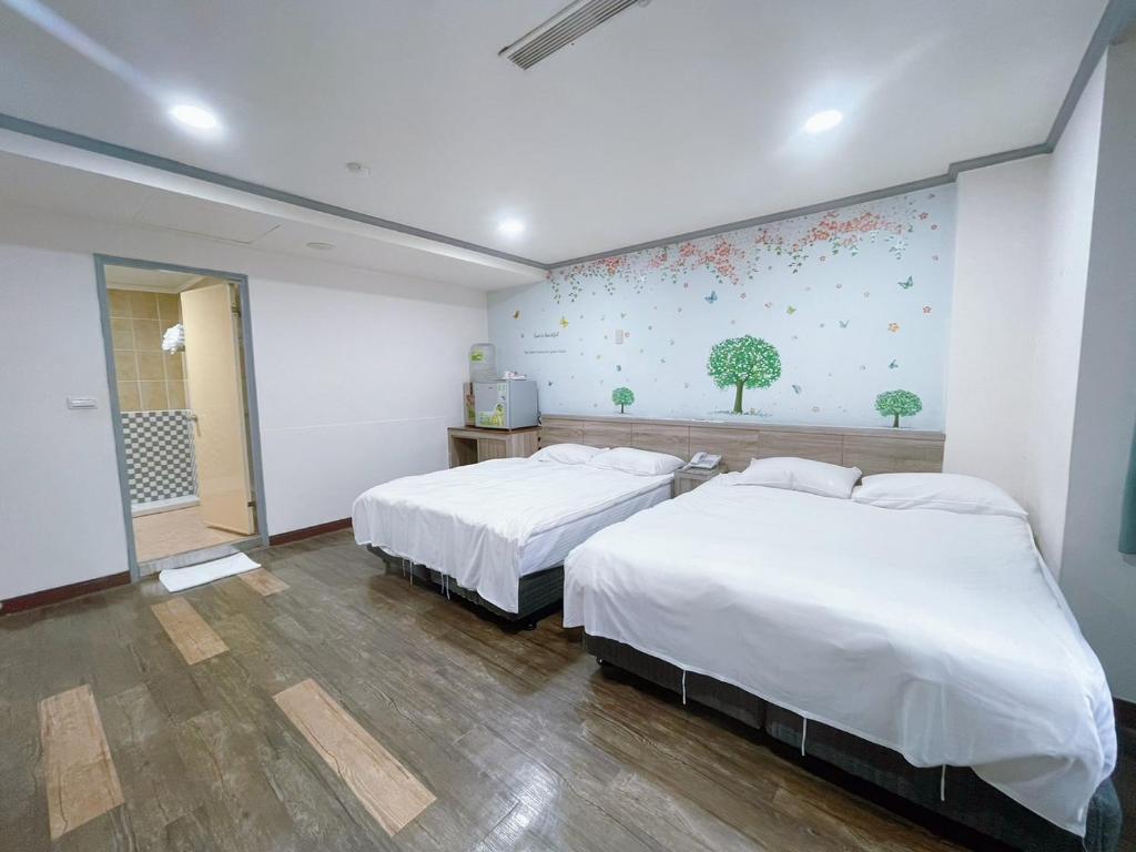 Postel nebo postele na pokoji v ubytování A22 Wei Lu Hotel