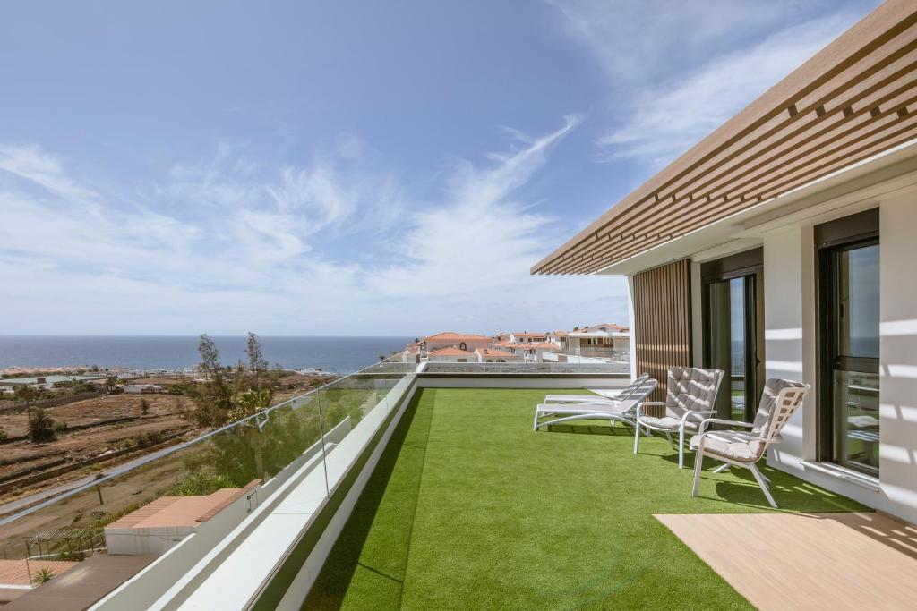 a balcony with a view of the ocean at Panoramic views - Paraísos de Agaete in Agaete