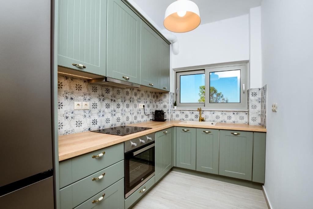 A kitchen or kitchenette at Akrotiri Seaside Project