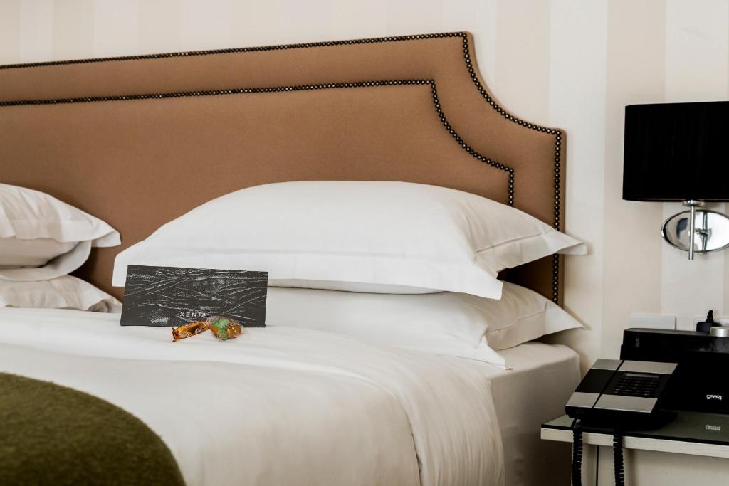 Postel nebo postele na pokoji v ubytování Hotel Xenia - Autograph Collection