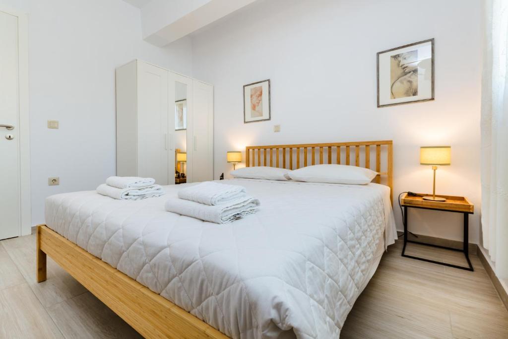 A bed or beds in a room at Akrotiri Seaside Project