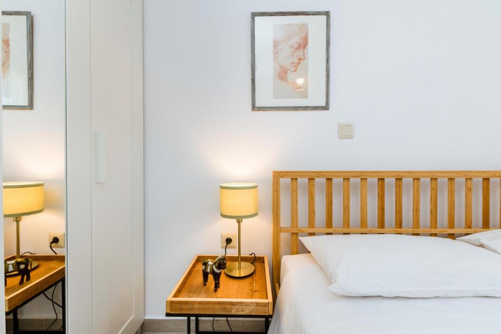 A bed or beds in a room at Akrotiri Seaside Project