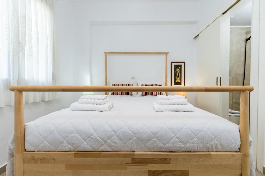 A bed or beds in a room at Akrotiri Seaside Project