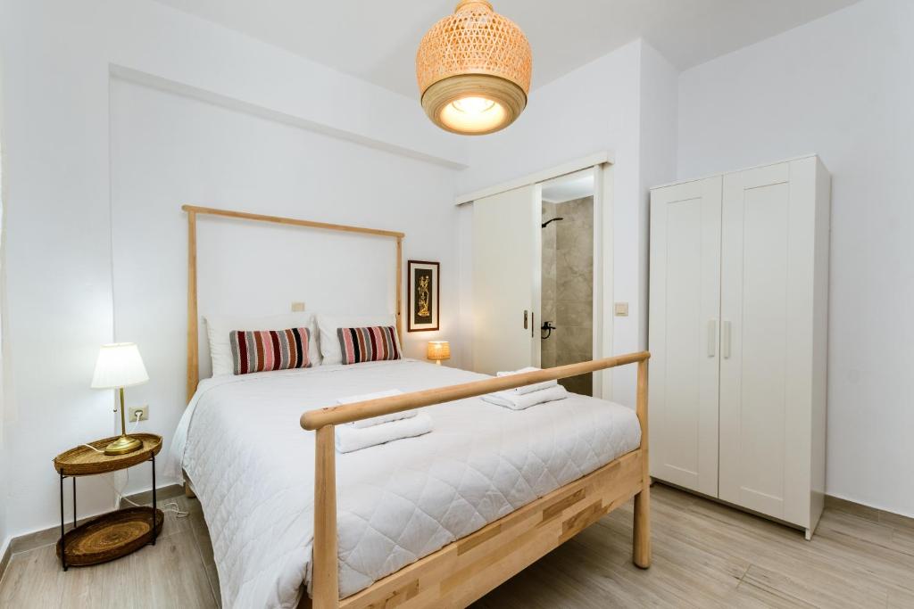 A bed or beds in a room at Akrotiri Seaside Project