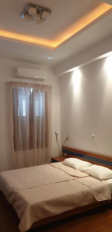 Postel nebo postele na pokoji v ubytování Pia Rooms