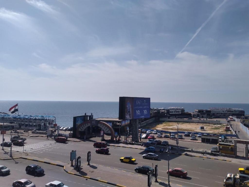 a view of a parking lot with cars on a highway at Serine Hostel in Alexandria