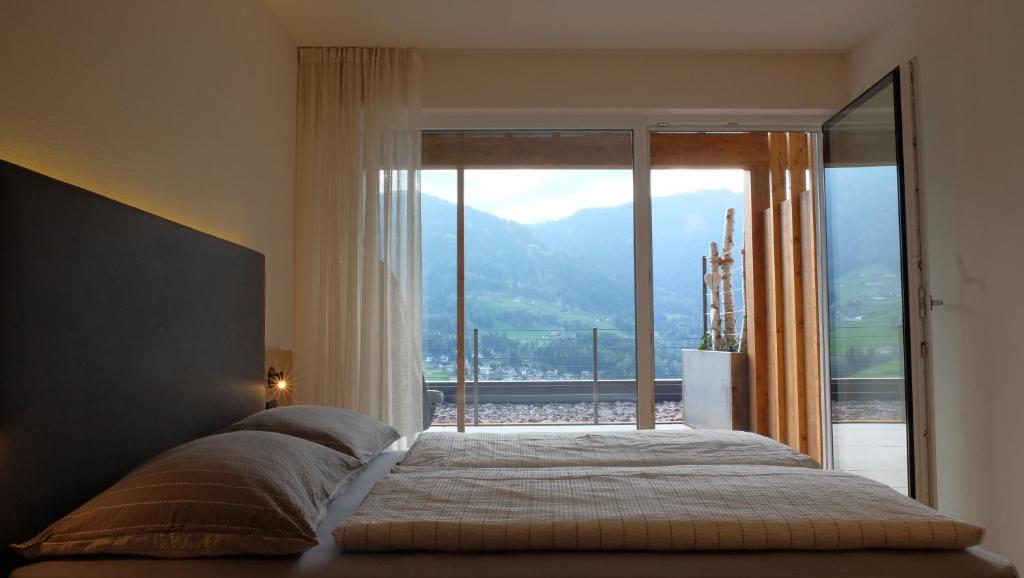 Postel nebo postele na pokoji v ubytování Runk Apartments