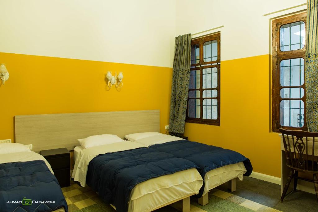 Voodi või voodid majutusasutuse Al-Hakim Boutique Hotel Old Town Nazareth toas