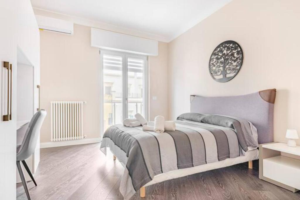 A bed or beds in a room at Poste Rooms 28