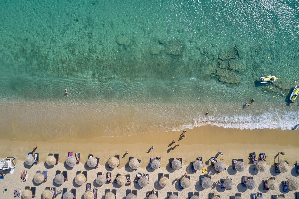 an overhead view of a beach with a group of people at Arte & Mare Elia Luxury Suites and Villas in Elia Beach