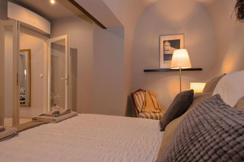 Postel nebo postele na pokoji v ubytování Heraclea Residential Apartments