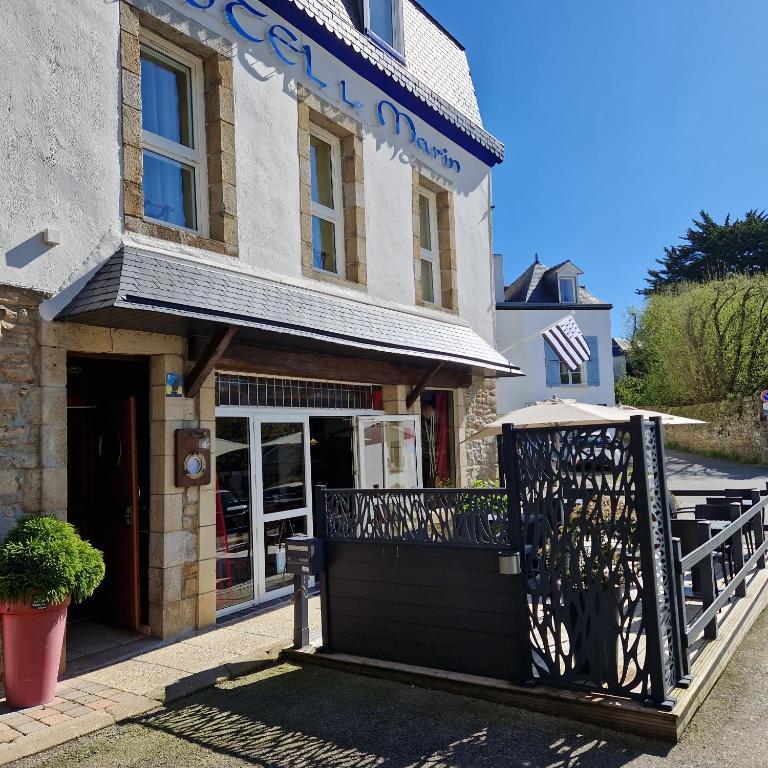 a building with a gate in front of it at Hotel Le Marin in Auray