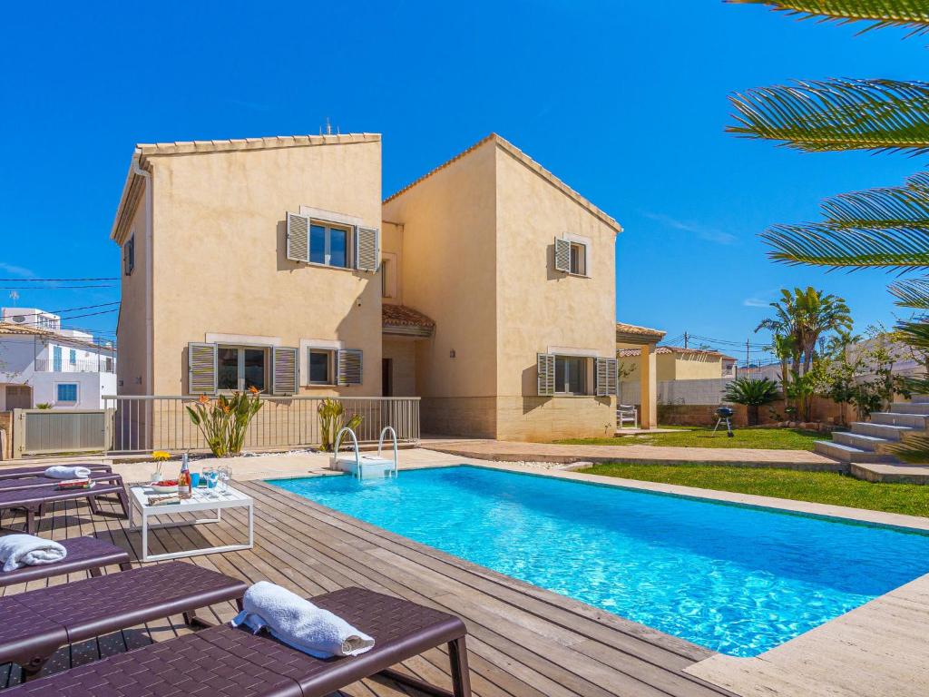 a villa with a swimming pool in front of a house at Villa Son Jil by Interhome in Alcudia