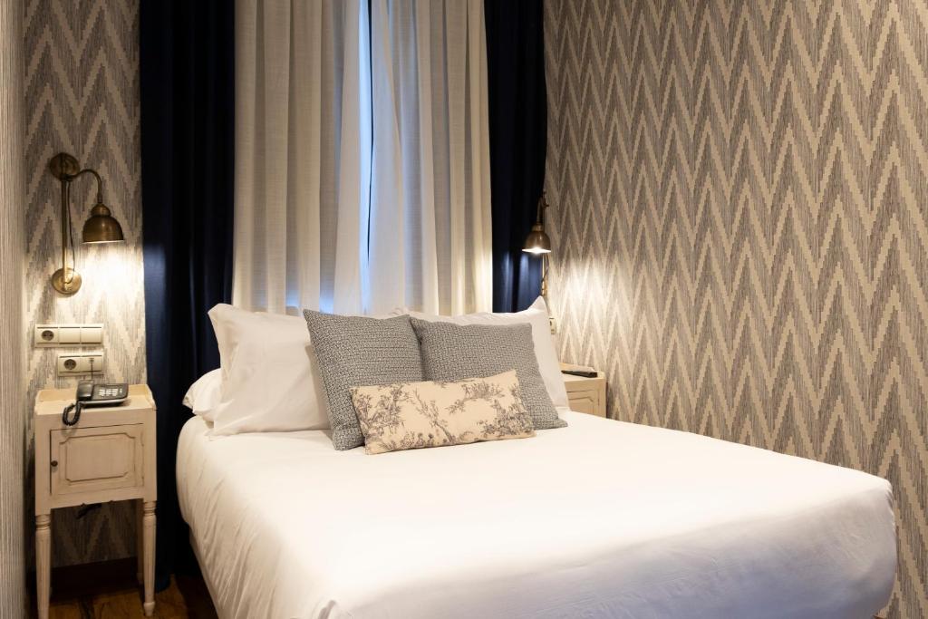 Postel nebo postele na pokoji v ubytování Hotel Cetina Palacio de los Salcedo
