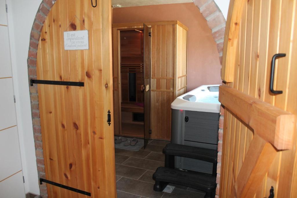 a small bathroom with a sink and a doorway at Happy & Relax in Mentque-Nortbécourt