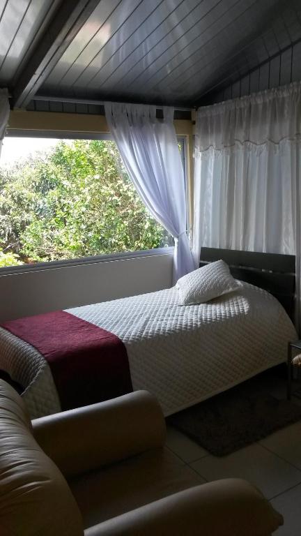 Postel nebo postele na pokoji v ubytování Hostal el Parque Tababela