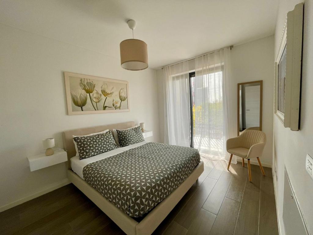 Säng eller sängar i ett rum på Stupendo appartamento in Fiera Milano-Up Town