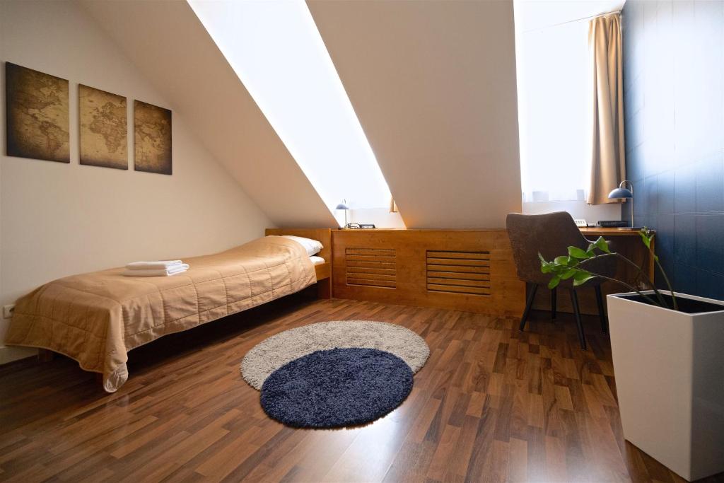 Posteľ alebo postele v izbe v ubytovaní Grand Hotel Trenčin
