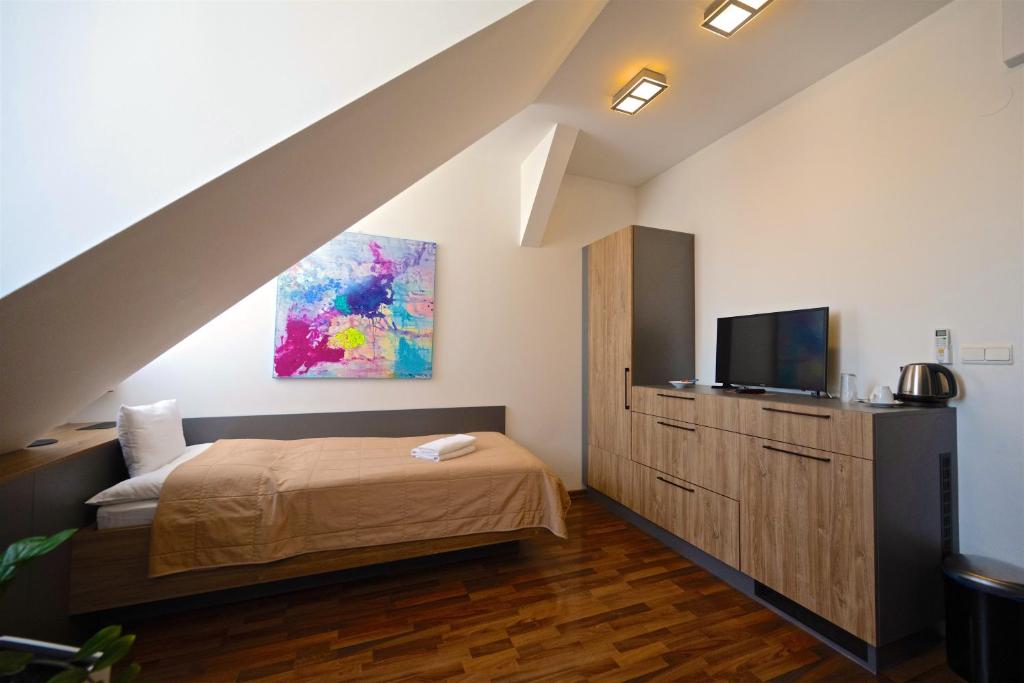 Televízia a/alebo spoločenská miestnosť v ubytovaní Grand Hotel Trenčin