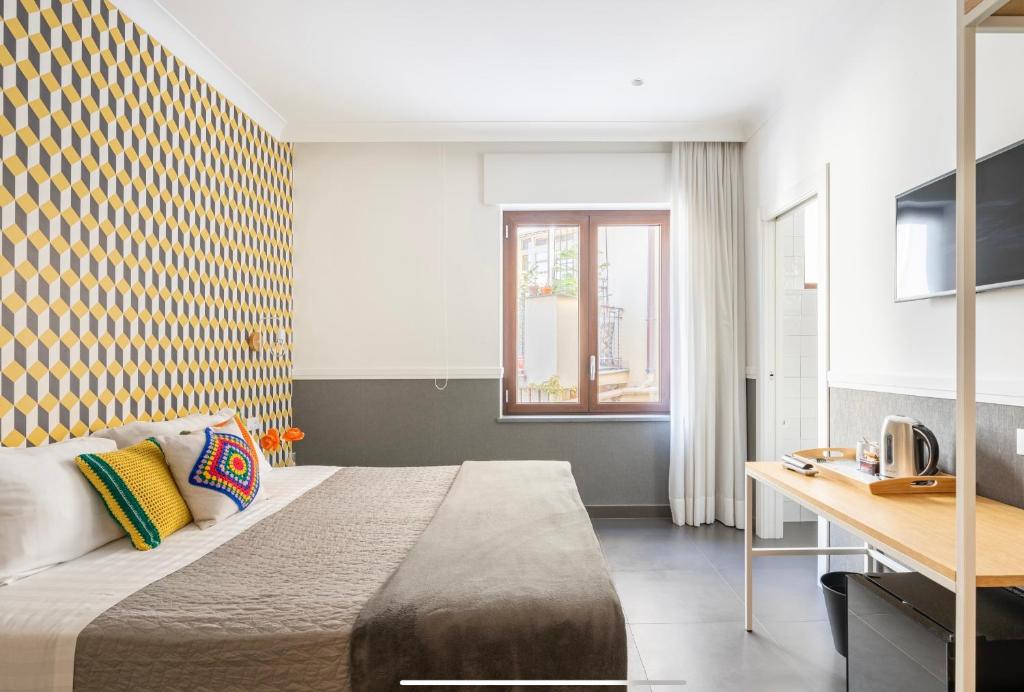 Postel nebo postele na pokoji v ubytování Delle rose inn