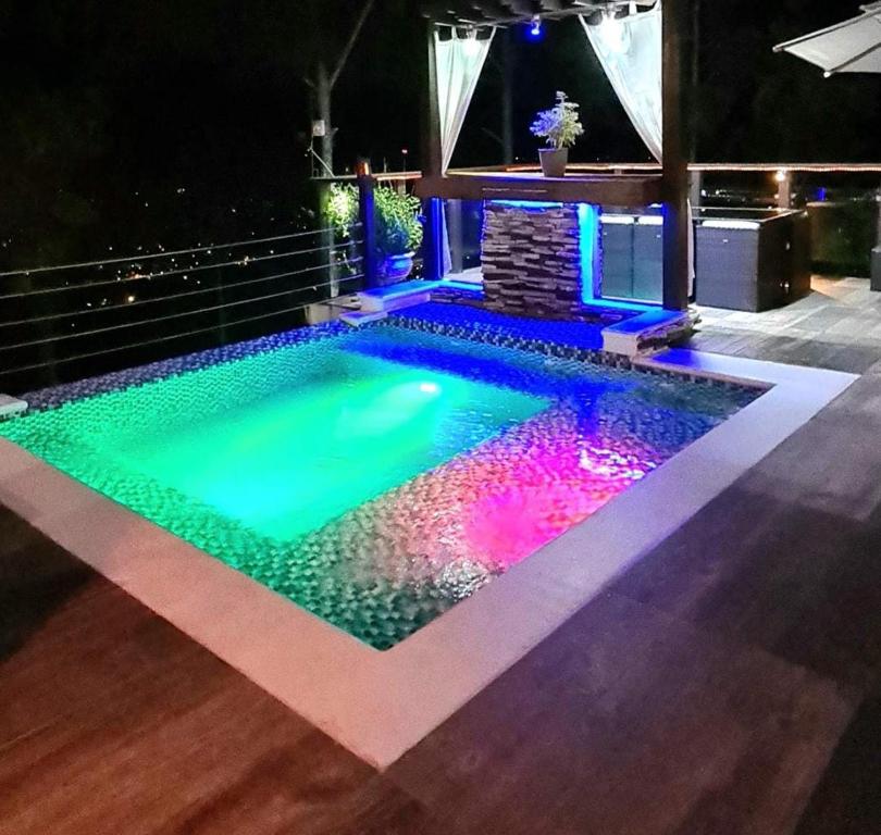 a swimming pool in the middle of a house at Montañas VIP Family Room in Constanza