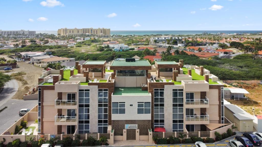 an aerial view of a building with green roofs at Bocobay Aracari Condo Hotel in Palm-Eagle Beach