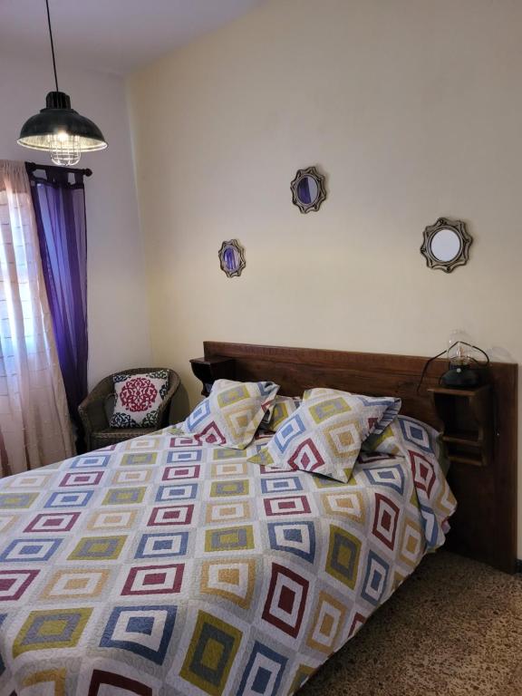 Posteľ alebo postele v izbe v ubytovaní Casa Punta del Sol Vista Al Atlántico