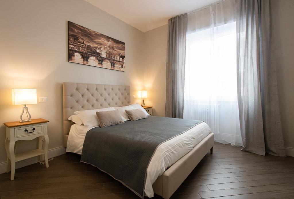 a bedroom with a large bed and a window at Dream Holiday Home in Rome