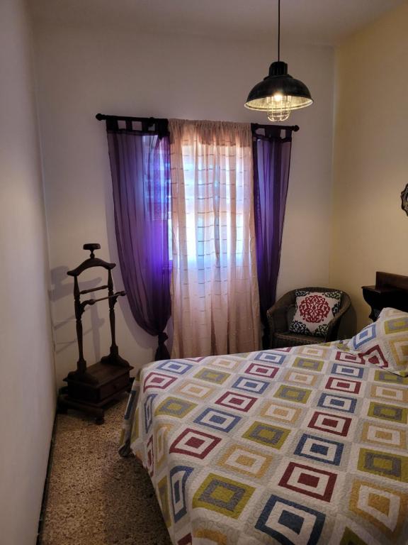 Posteľ alebo postele v izbe v ubytovaní Casa Punta del Sol Vista Al Atlántico