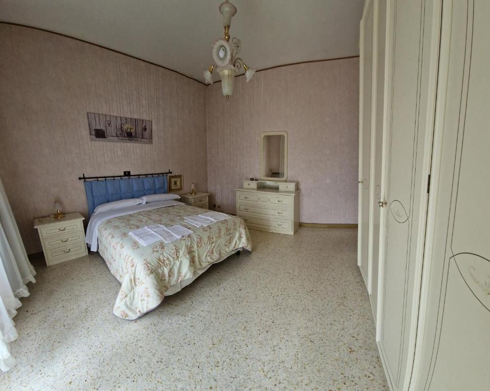 Postel nebo postele na pokoji v ubytování la casa di mimiì