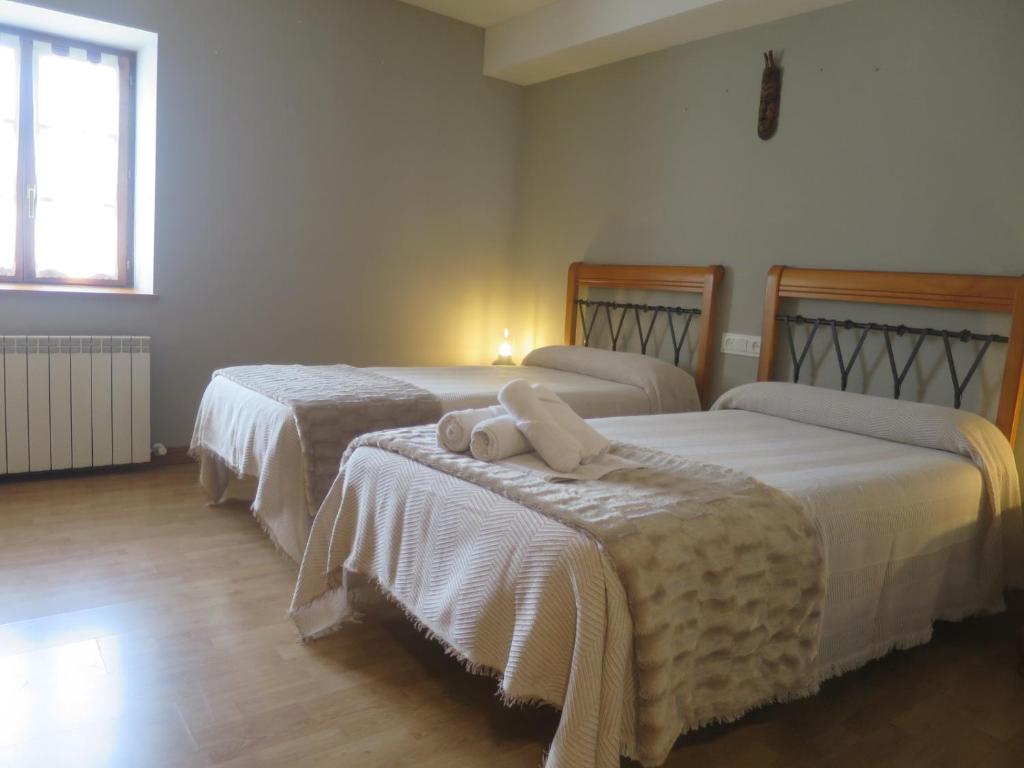 Postel nebo postele na pokoji v ubytování Posada de Oitz