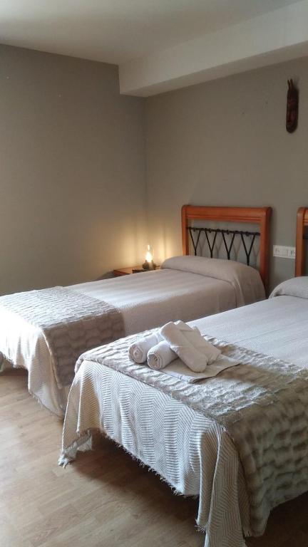 Postel nebo postele na pokoji v ubytování Posada de Oitz