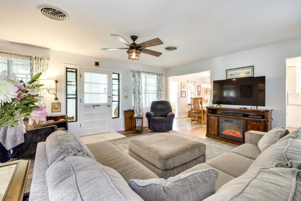 a living room with a couch and a fireplace at Mount Dora Vacation Rental Steps to Lake Gertrude in Mount Dora