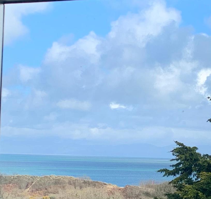 a view of the ocean from a train window at The Wylfa in Abersoch