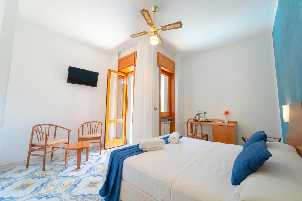 Postel nebo postele na pokoji v ubytování Hotel San Pietro