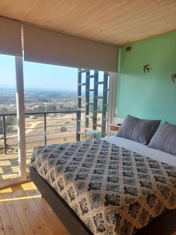 Giường trong phòng chung tại Del Cerro Pichilemu