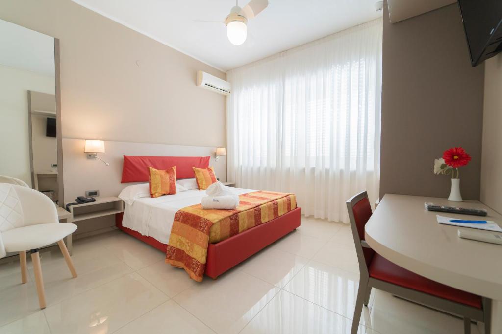 Postel nebo postele na pokoji v ubytování Hotel San Pietro