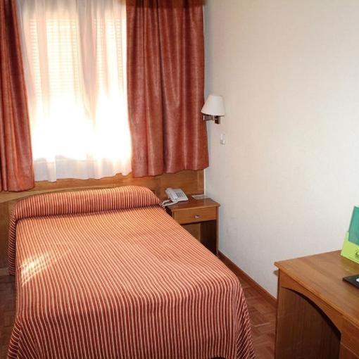 Postel nebo postele na pokoji v ubytování Hotel Las Tablas