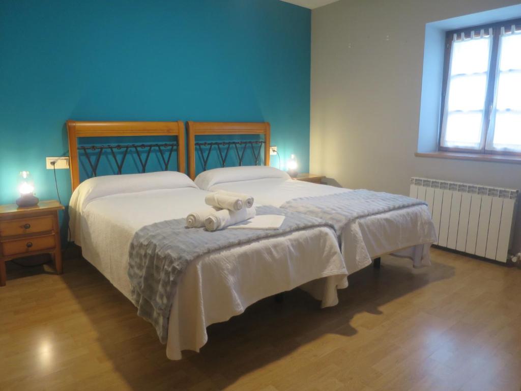Postel nebo postele na pokoji v ubytování Posada de Oitz