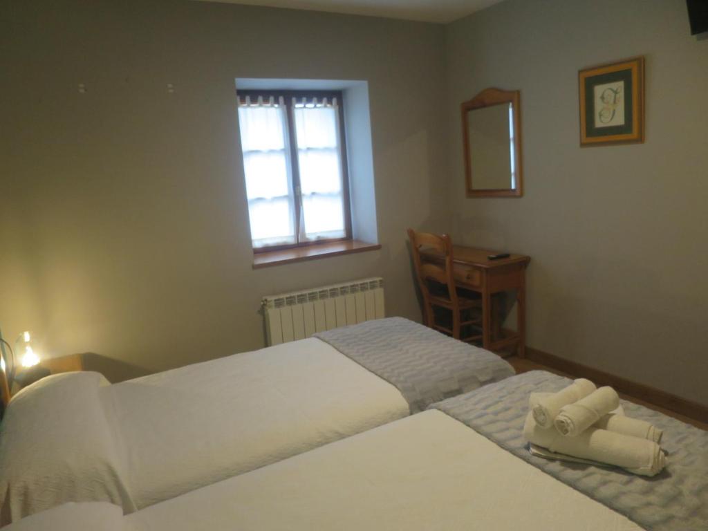 Postel nebo postele na pokoji v ubytování Posada de Oitz