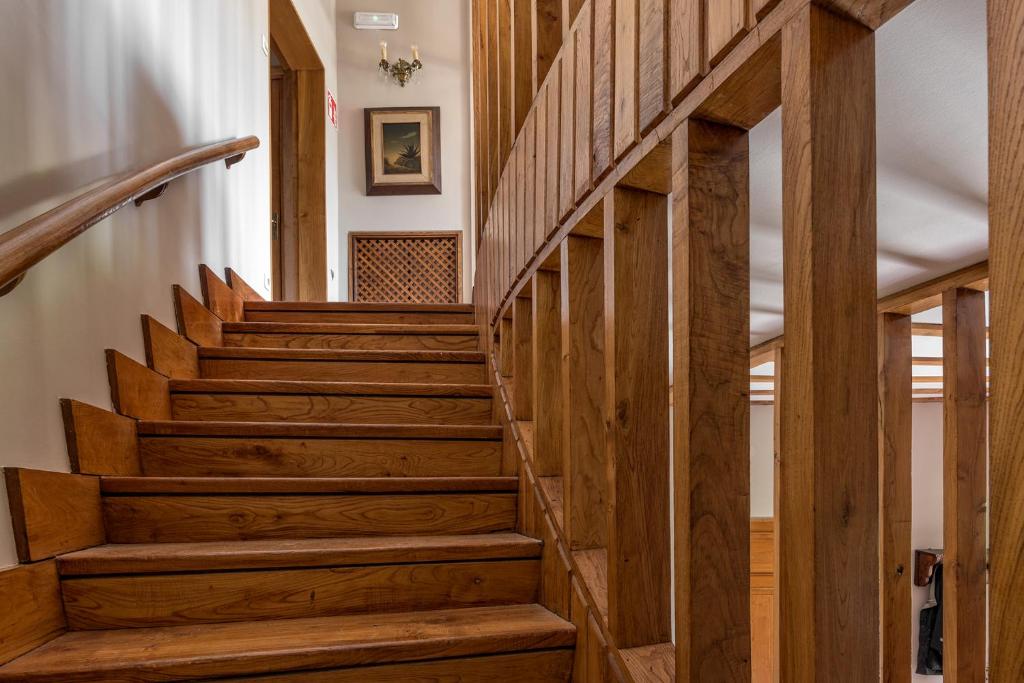 a wooden staircase in a house with wooden floors at Hotel Hontoria in Hontoria