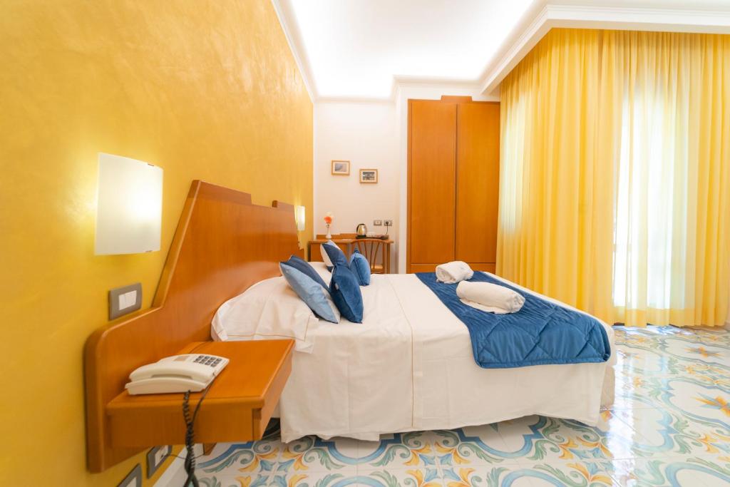 Postel nebo postele na pokoji v ubytování Hotel San Pietro